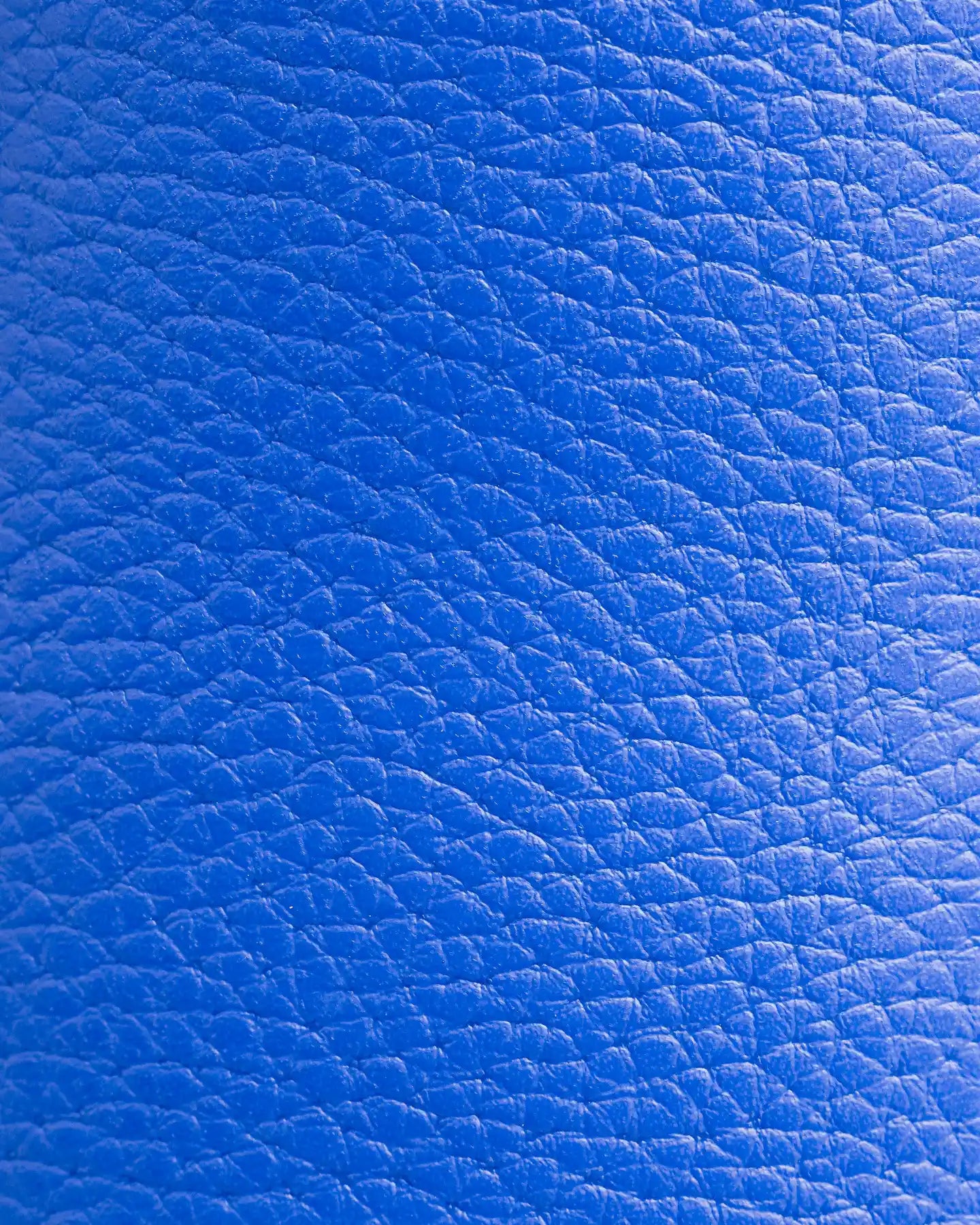 Close-up of Snibbs The Clog - Bluing, featuring textured blue vegan leather with visible grain and natural creases.