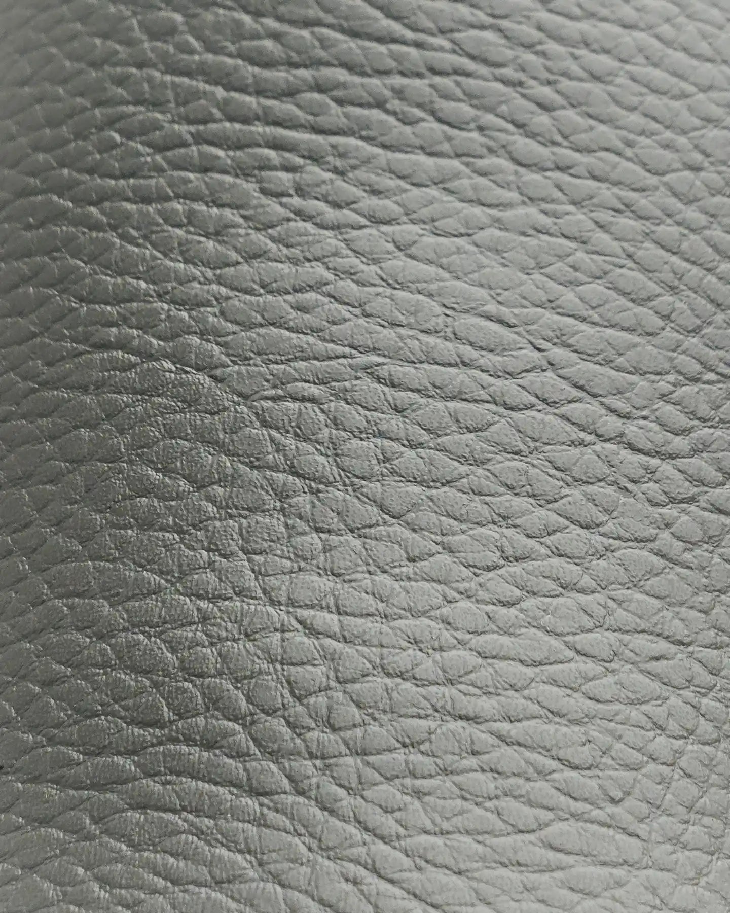 Close-up of Snibbs The Clog - Charcoal: textured vegan leather, visible grain, natural creases, and water-resistant finish.