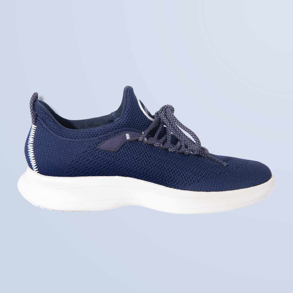 The Snibbs Orbit in Maritime Blue features a knit upper, white sole, and patterned laces shown on a light blue background.