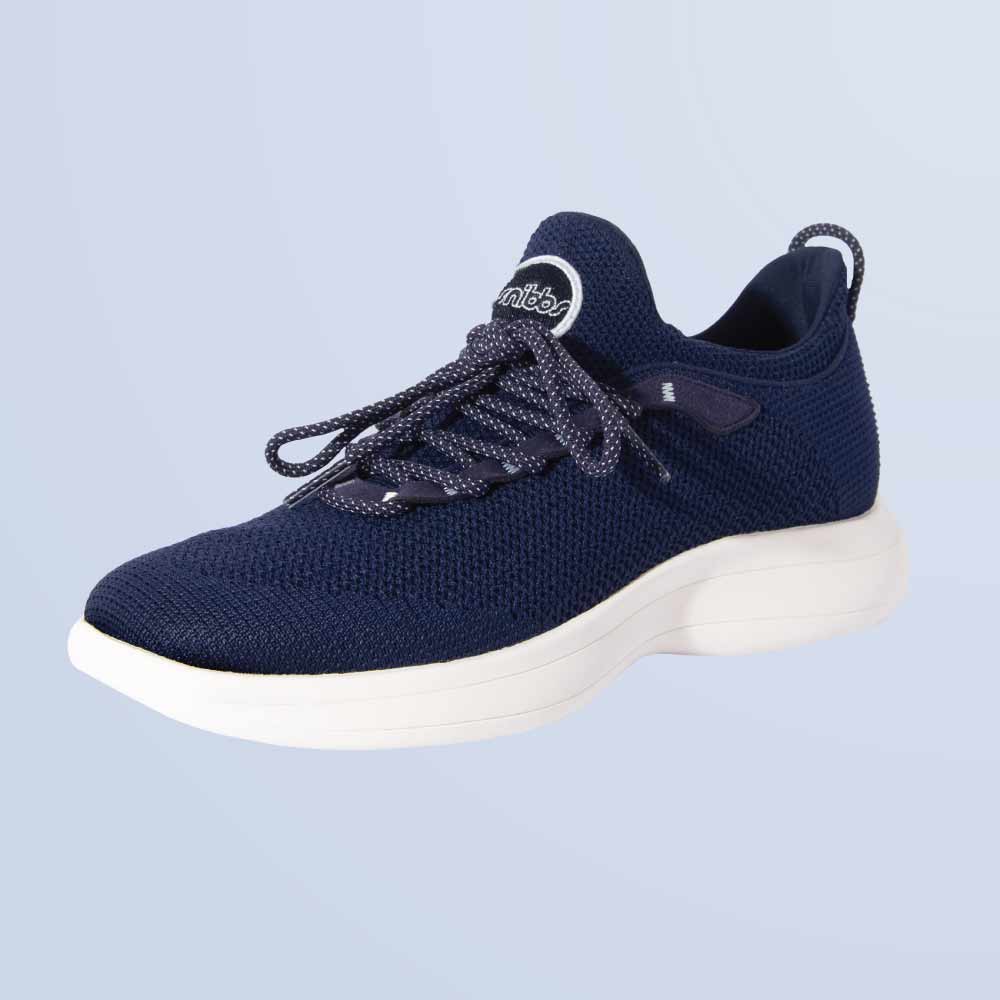 Snibbs Orbit in Maritime Blue: breathable knit, white sole, dark laces, heel pull tab—displayed on a light blue background.