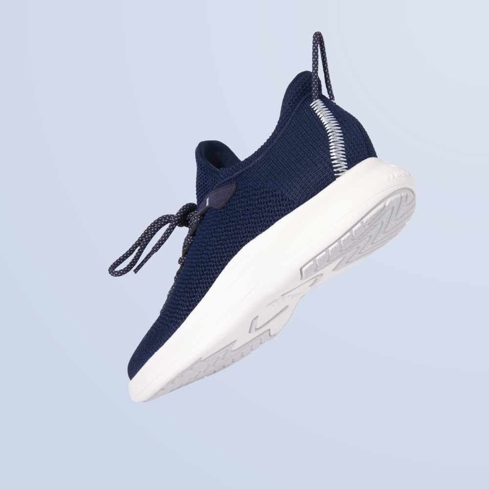 The Snibbs Orbit - Maritime Blue sneaker features a breathable knit upper and white sole, shown from the side against a light background.