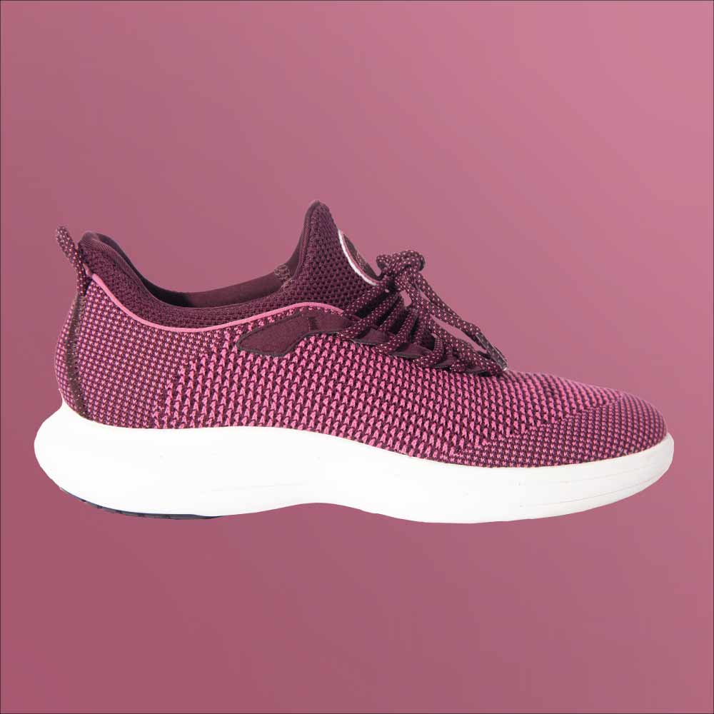 The Snibbs Orbit - Wine Tasting sneaker features a purple knit upper, white sole, laces, and low-cut design on a pink background.