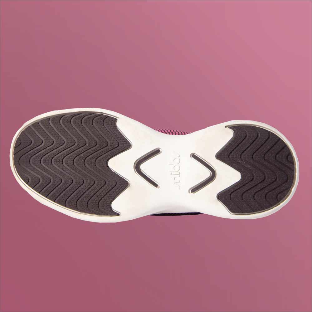 The Snibbs Orbit - Wine Tasting sole features black wavy tread, white accents, and is slip-resistant, shown from below on pink.