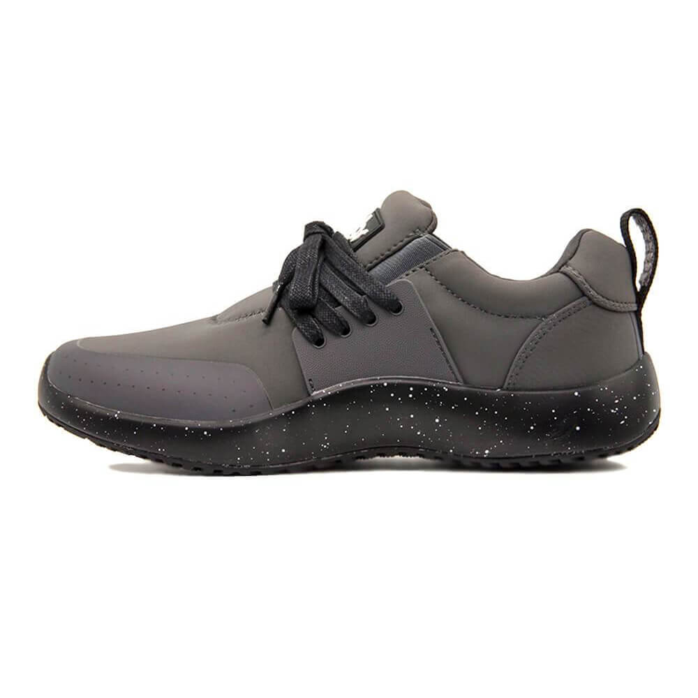 The Men's Spacecloud - Charcoal sneaker, featuring black and dark gray colors with black laces and a speckled black, slip-resistant sole, is displayed in side profile against a white background.
