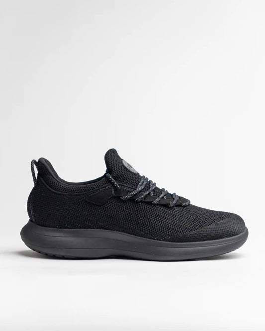 Snibbs Orbit - Eclipse Black: a black knit athletic sneaker with black sole and laces, shown in profile on white background.