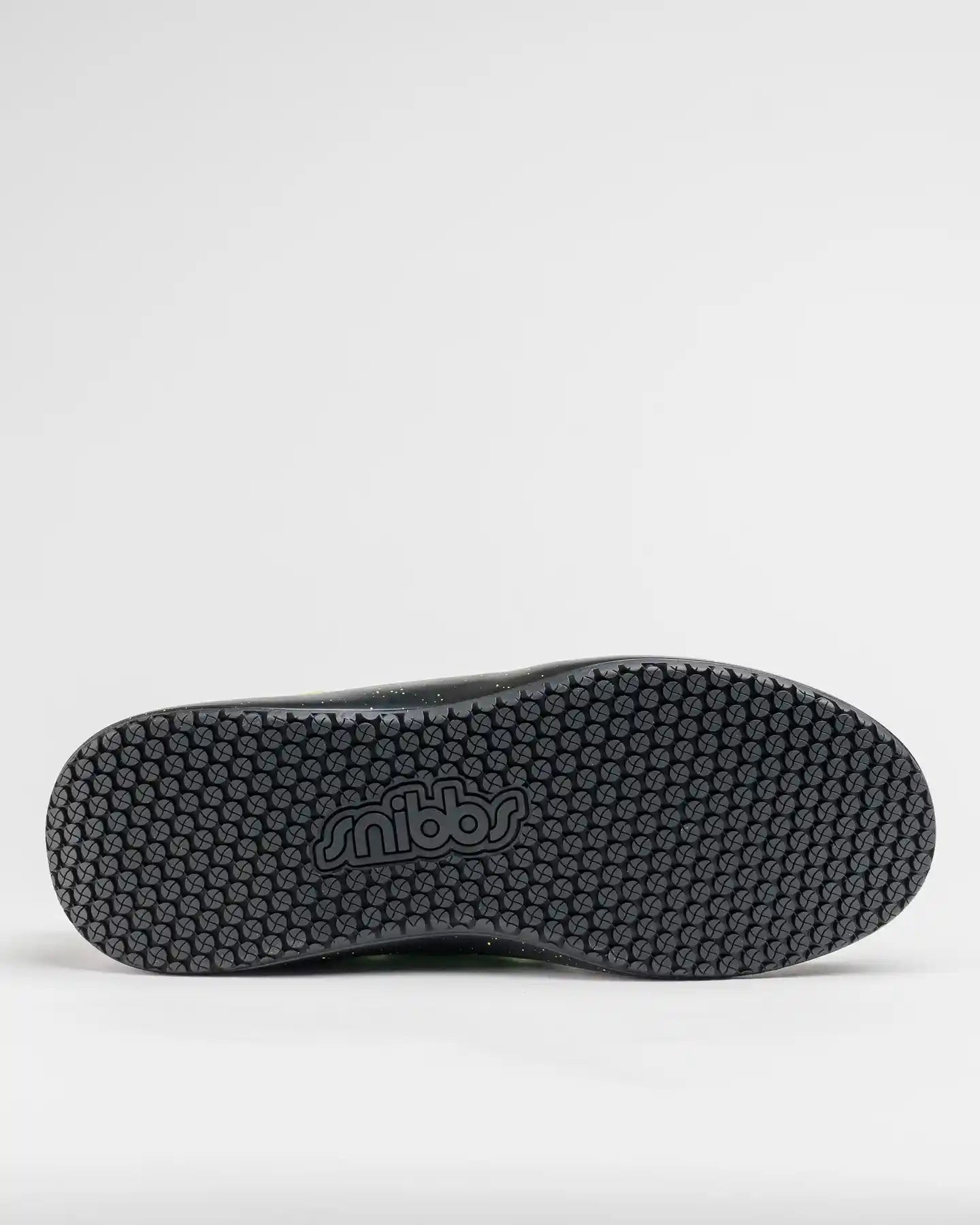 The image shows the black, slip-resistant sole of a Snibbs Spacecloud 2.0 - Lime Truck sneaker on a plain white background.