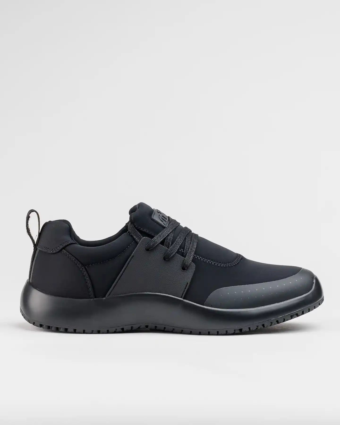The Snibbs Spacecloud 2.0 - Eclipse Black: a lace-up work sneaker with heel pull tab and slip-resistant sole, shown in side profile.