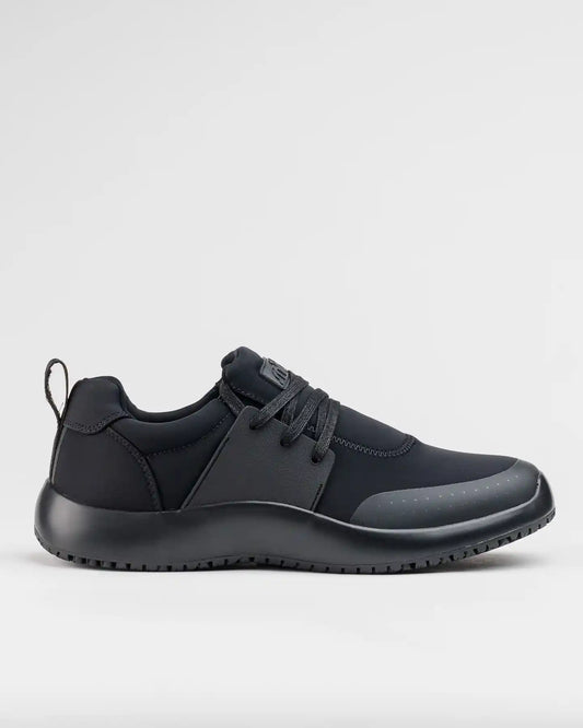 The Snibbs Spacecloud 2.0 - Eclipse Black: a lace-up work sneaker with heel pull tab and slip-resistant sole, shown in side profile.