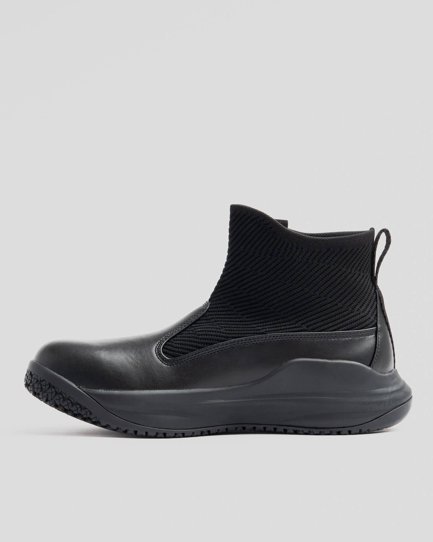 The Snibbs Pro - Eclipse Black: ankle-high, premium knit upper, rubber sole, and pull tab. Shown in profile on a plain light background.