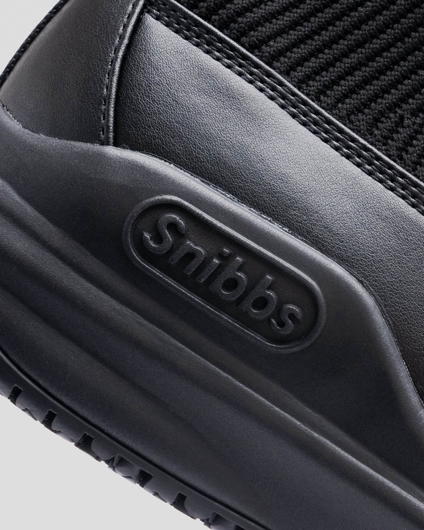 Close-up of the Pro - Eclipse Black heel by Snibbs, showcasing its premium knit upper for enhanced style and comfort.