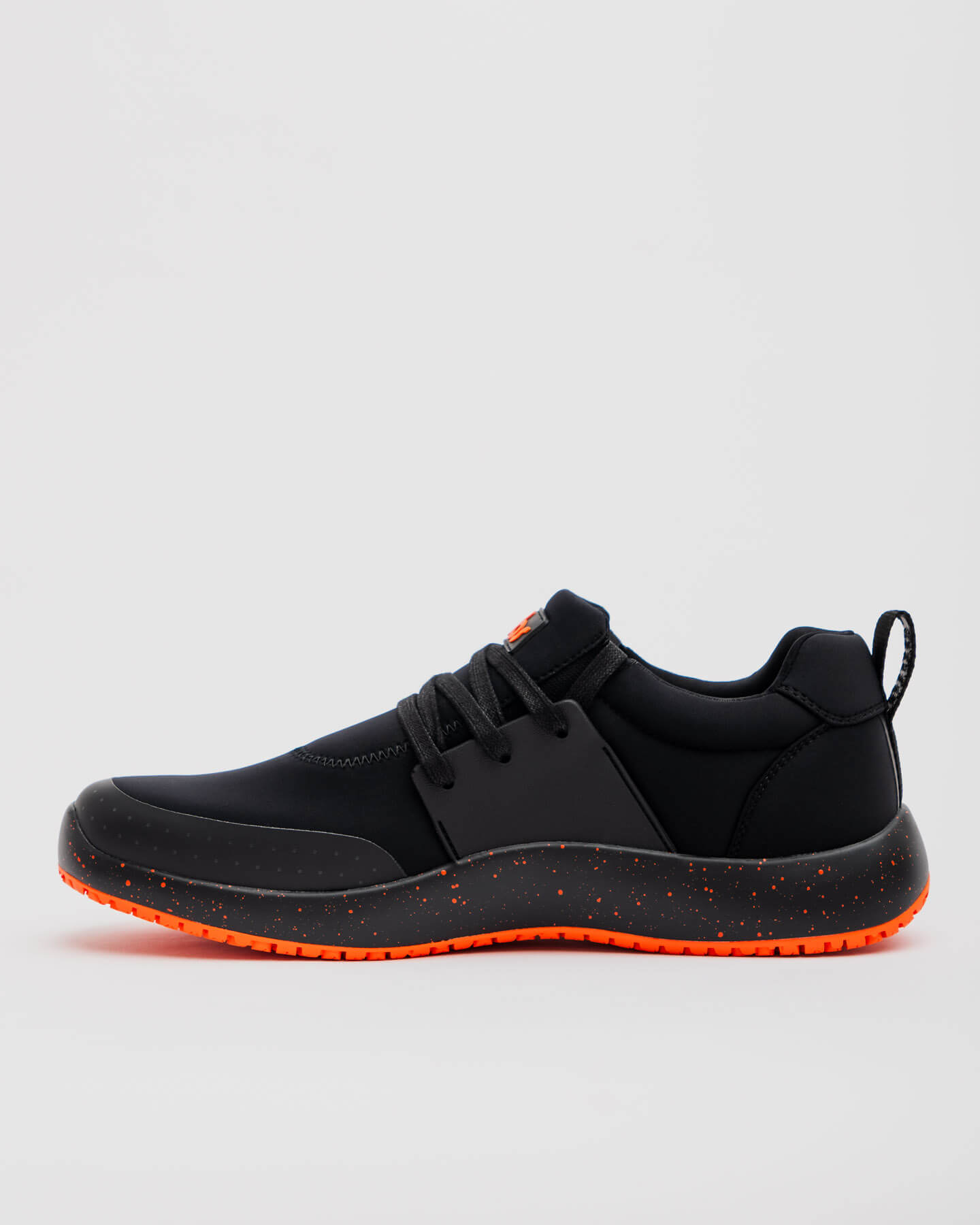 Snibbs Spacecloud 2.0 - Tangerine: black vegan work sneaker with orange-speckled sole, side view on plain light background.