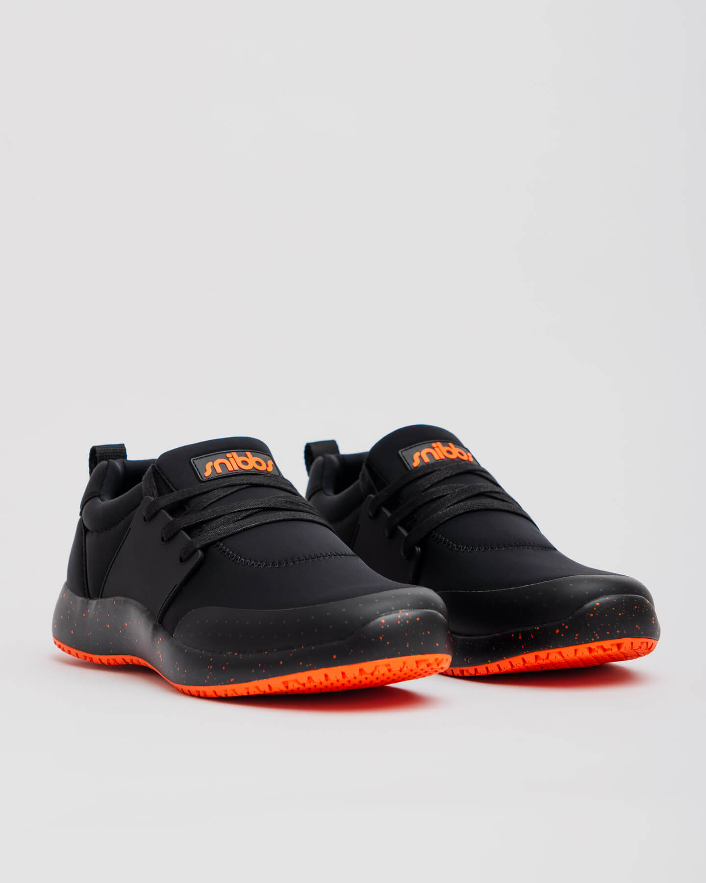Snibbs Spacecloud 2.0 - Tangerine: Black vegan work sneakers with orange soles and logos, designed for slip resistance.