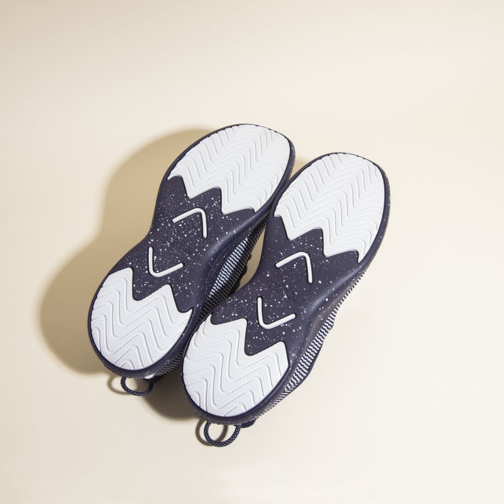 Snibbs Orbit - Blueberry Jam: blue athletic shoes with lightweight, slip-resistant white outsoles and speckled zigzag tread for style and grip.